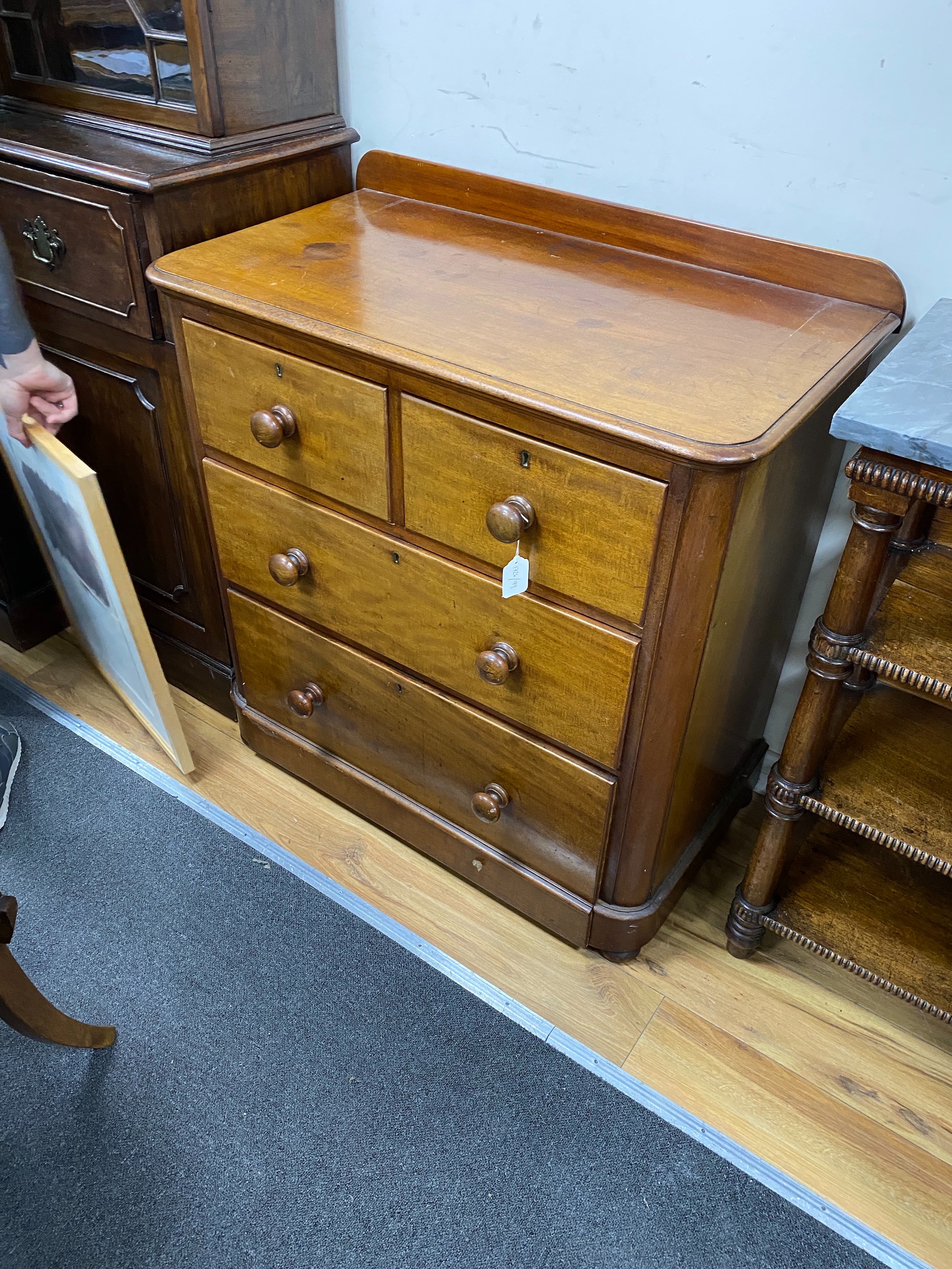 A small Victorian satinwood and mahogany chest of two short and two long drawers, width 89cm, depth 49cm, height 95cm